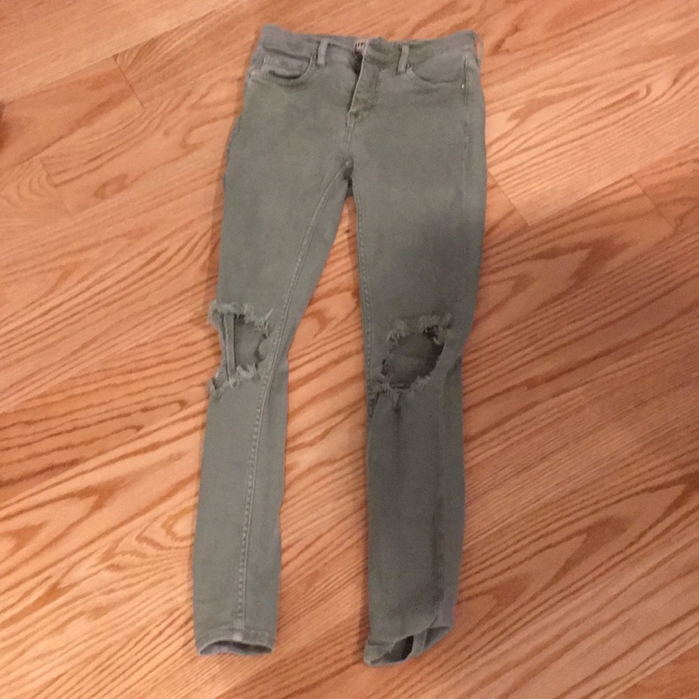 green ripped jeans